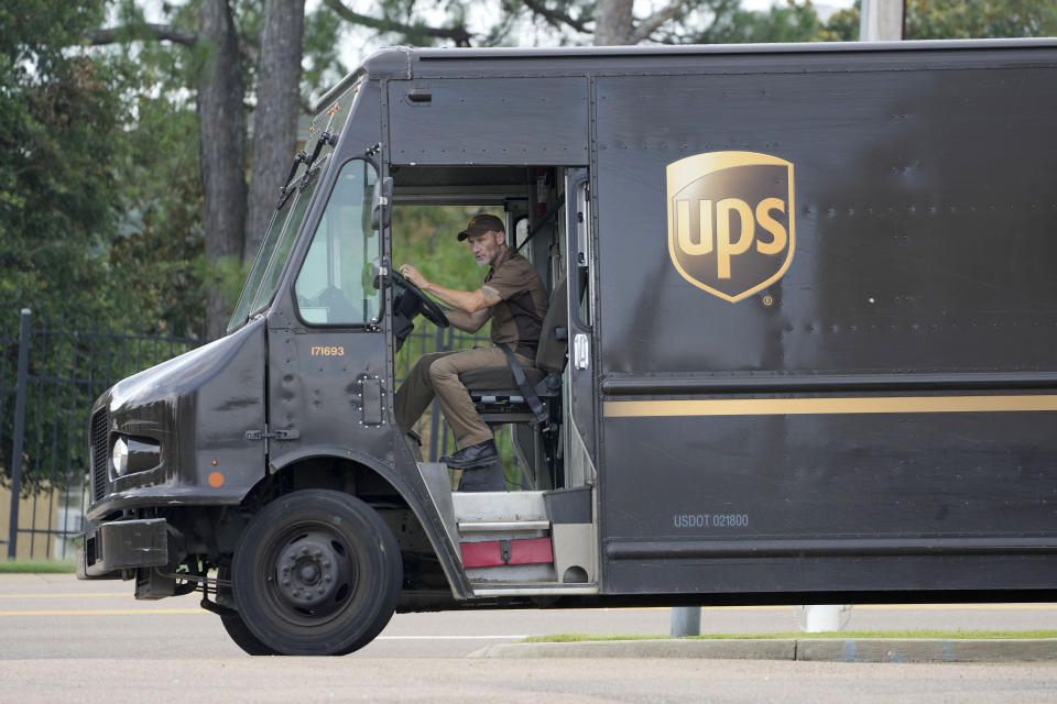 A UPS driver pulls out of an office complex, Wednesday, July 12, 2023, in Jackson, Miss. (AP Photo/Rogelio V. Solis)