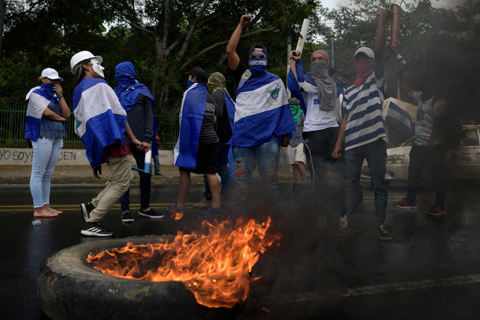 Students from different universities from across Nicaragua demand President Daniel Ortega and his powerful vice president, wife Rosario Murillo, to resign and the government to keep the 6% budget for universities, in Managua, on August 2, 2018. - The death toll in violent protests in Nicaragua against Ortega stands at 317, a US-based regional rights group said Thursday.