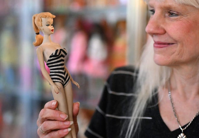 Barbie collector Bettina Dorfmann holds one of the first Barbies, which was presented at a toy fair in the USA in 1959, at her "Barbie clinic" in Duesseldorf, Germany on July 25.