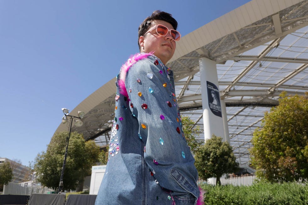 Sebastian Monsalve, 23, and Maria-Fernanda Quitral, 24, traveled from Santiago, Chile, and saved for two years to see Taylor Swift perform live for the first time. From flights, hotels and tickets, they collectively spent about $5,000 and Monsalve's jacket took about two weeks of work.