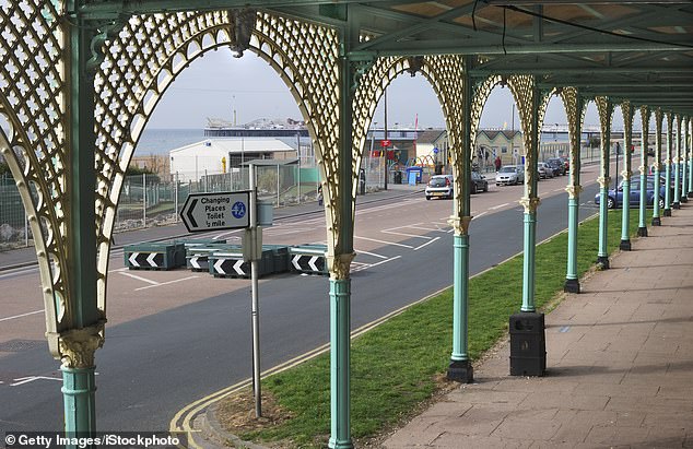 The seafront promenade at Brighton, East Sussex, where parking spaces can be seen on the right (stock image)