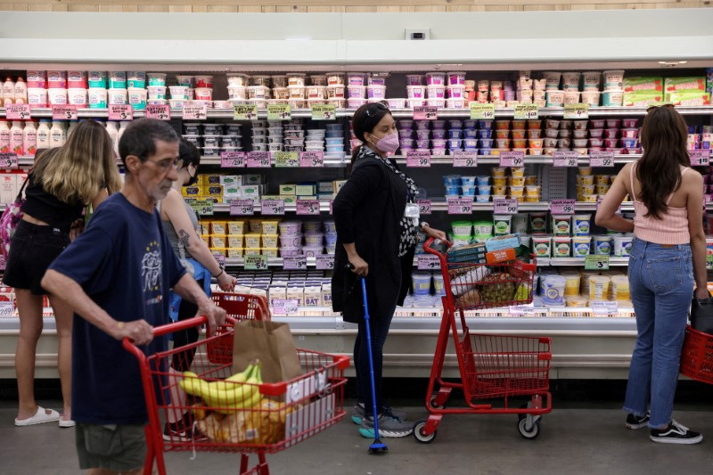 People shop in a supermarket as inflation affected consumer prices in Manhattan, New York City