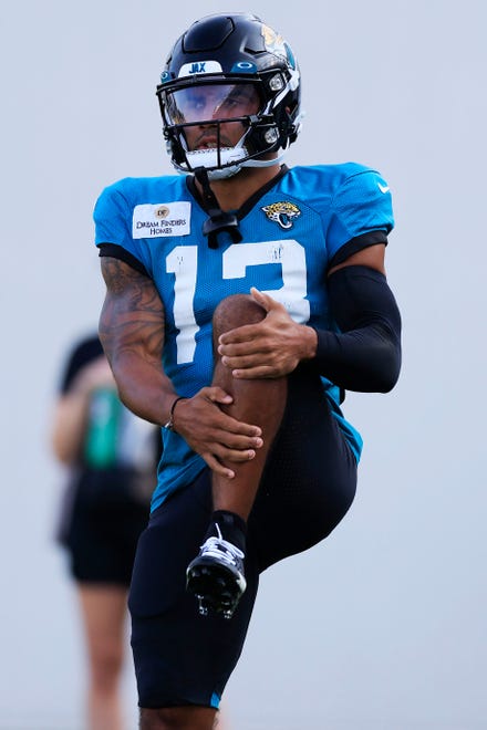 Jacksonville Jaguars wide receiver Christian Kirk (13) stretches Tuesday, Aug. 1, 2023 at Miller Electric Center at EverBank Stadium in Jacksonville, Fla. Today marked the first padded practice.