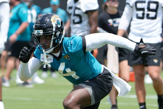 Jacksonville Jaguars running back Tank Bigsby (4) performs a drill during an NFL football rookie camp, Friday, May 12, 2023, in Jacksonville, Fla. (AP Photo/John Raoux)