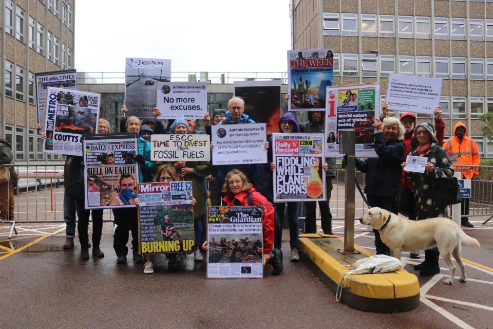 The protestors carried giant A1-sized reproductions of dramatic front-page newspaper coverage of the climate crisis from July (Photo: Divest Sussex)