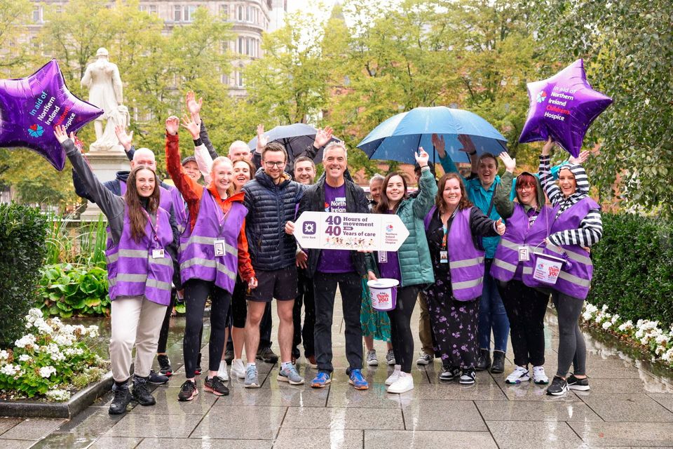 Teams from Ulster Bank and the NI Hospice with James Nesbitt at the finish line