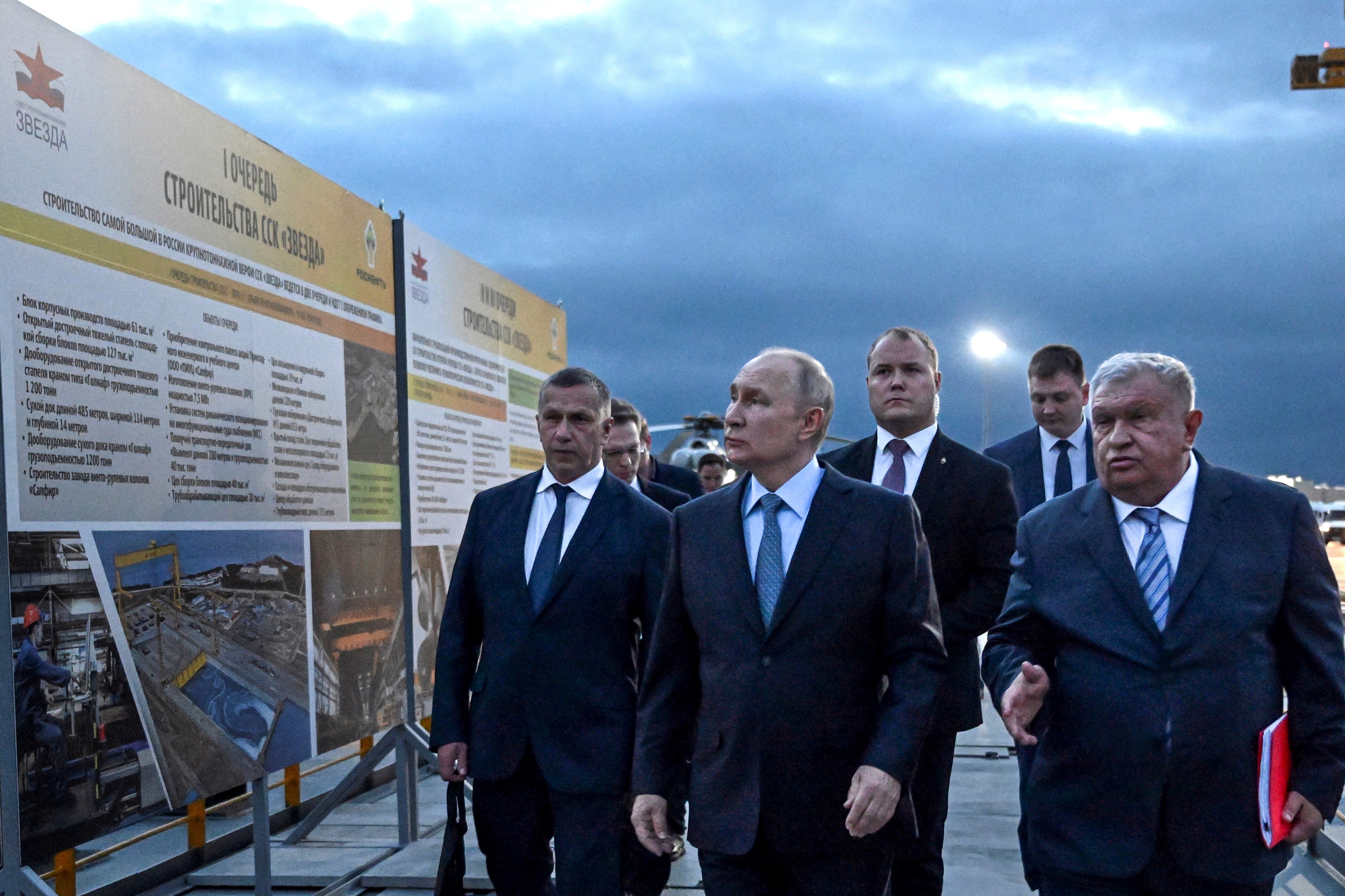 Russian President Vladimir Putin, center, and Russian CEO of Rosneft oil company Igor Sechin, right, visit 