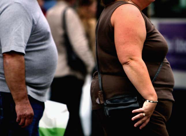 Overweight people walk in downtown Glasgow.