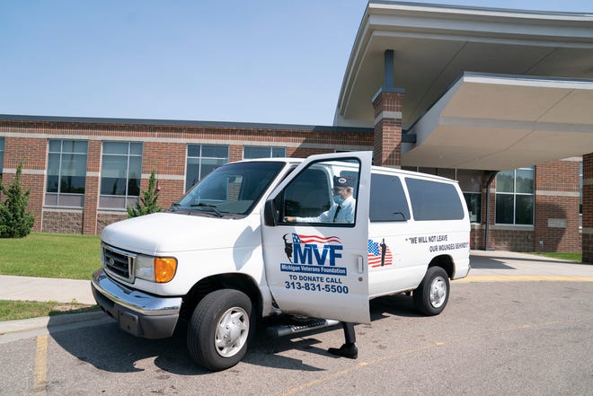 Robert Castillo, Resource Development Deputy for the Michigan Veterans Foundation jumps in the MVF van to help transport homeless veterans in Detroit on Tuesday, Aug. 29, 2023.