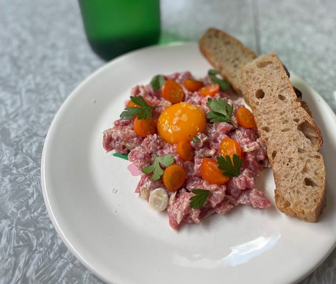 Beef tartare with Sungold tomatoes at Heavy Metal Sausage Co. in Philadelphia. The restuarant was named among the 24 best new restaurants in America this year by Bon Appetit.