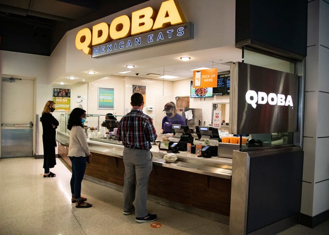 Customers give their orders at Qdoba in the Student Union at the University of Tennessee in Knoxville, Tenn., on Monday, Sept. 22, 2020.