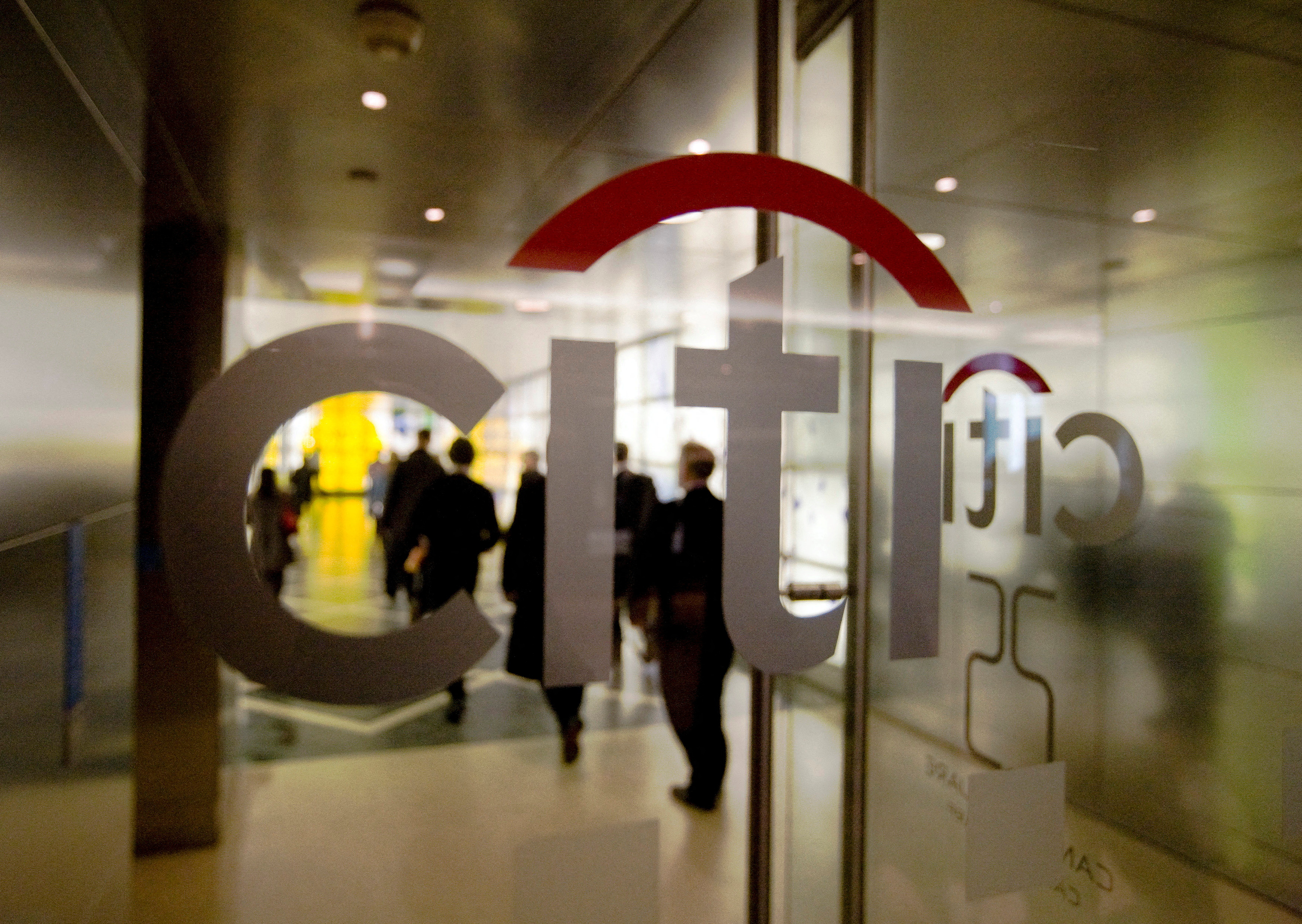 Staff enter the Citigroup building in London