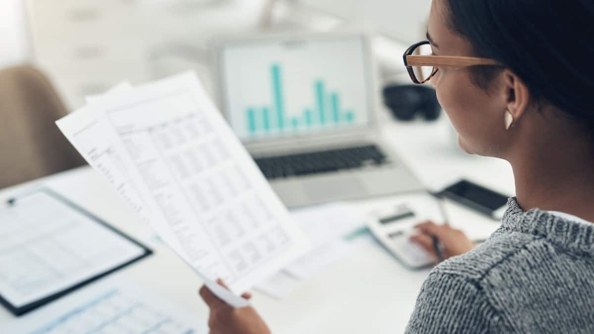 Businesswoman calculating finances in an office