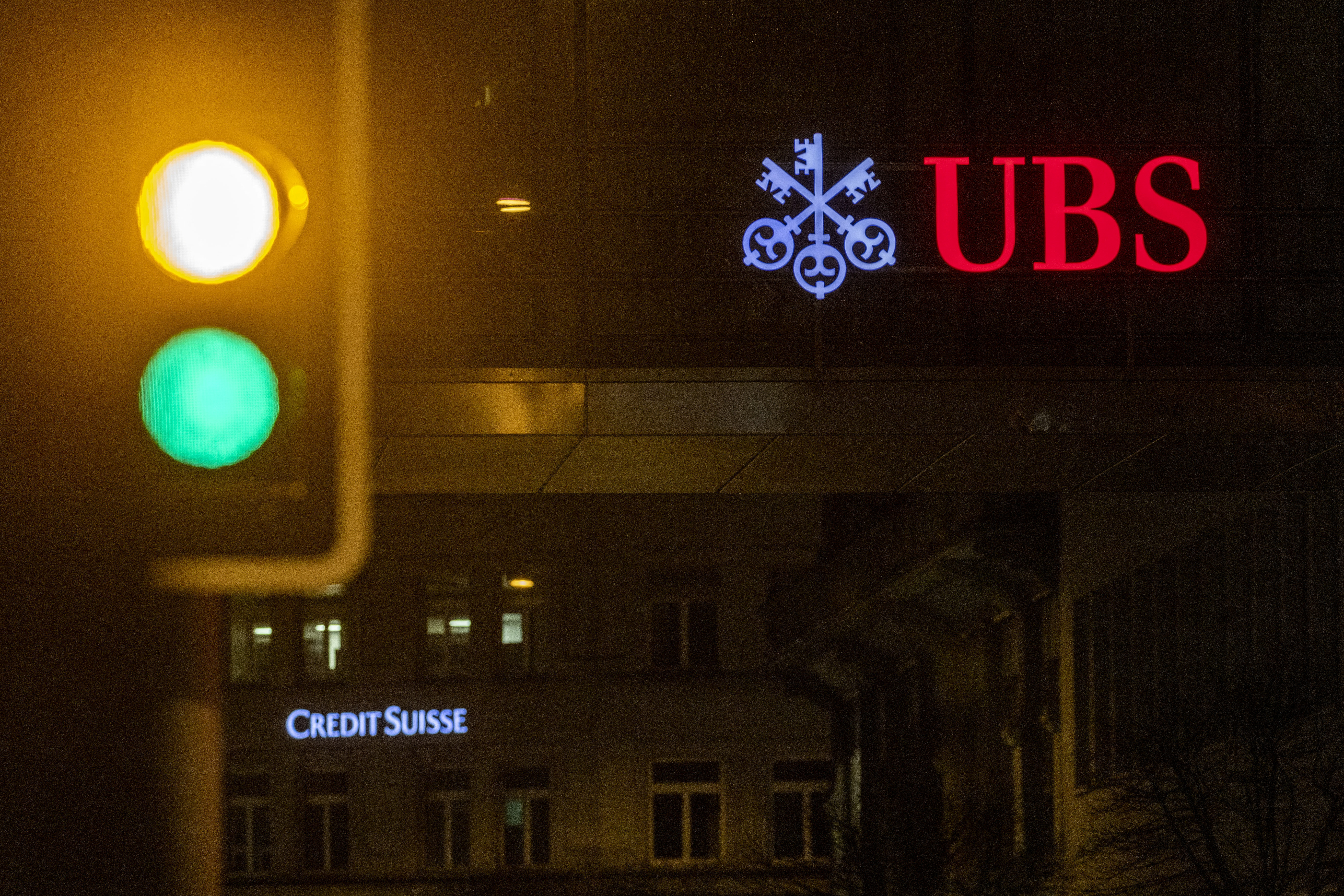 UBS and Credit Suisse banks logos are seen in Zurich