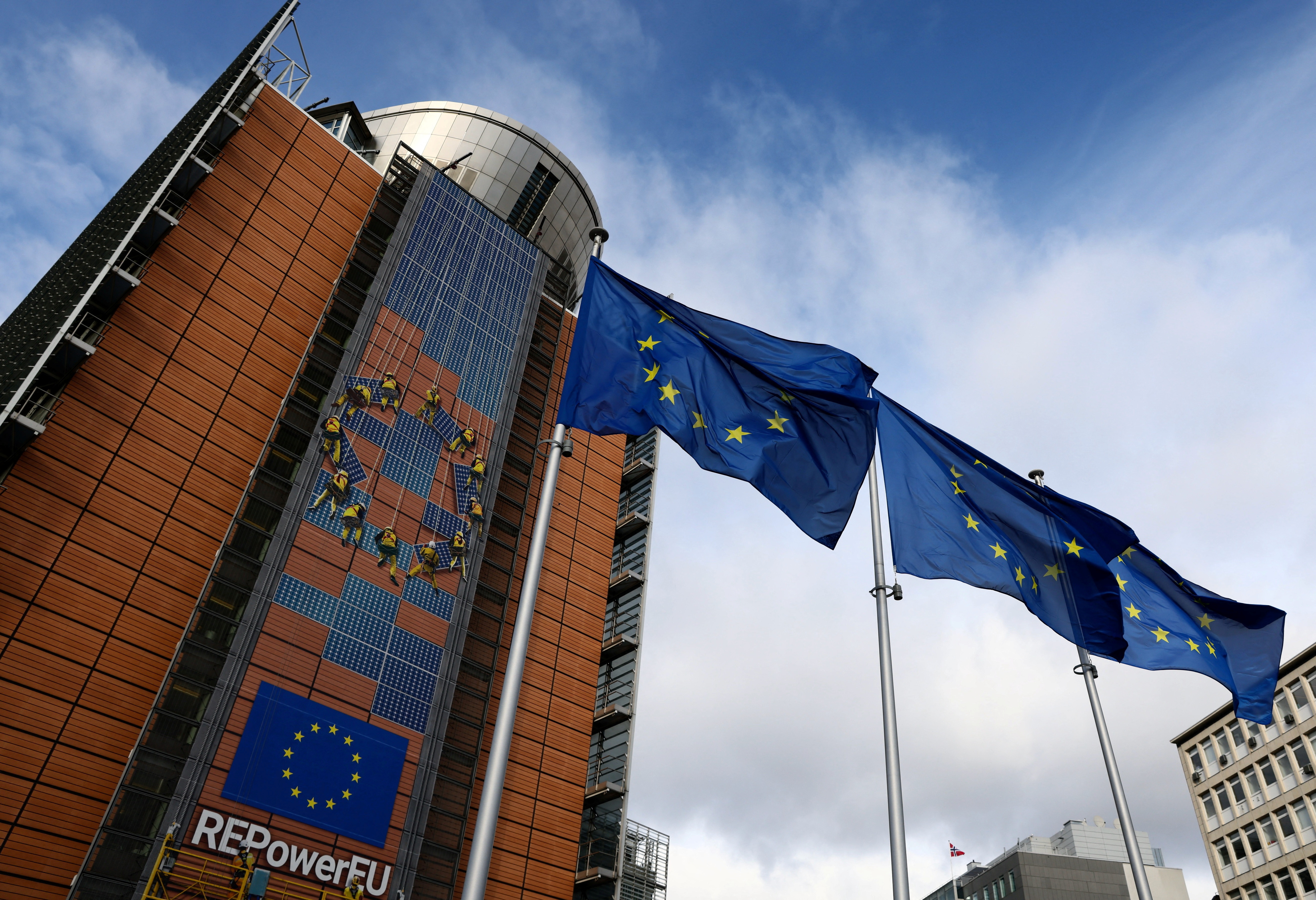 European Union flags flutter outside the EU Commission headquarters in Brussels