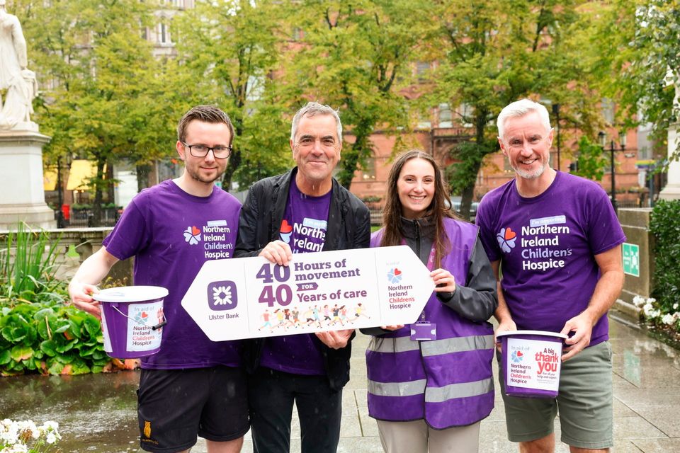 Matthew Palmer, James Nesbitt, Bonnie MacRae and Terry Robb celebrate together at the finish line