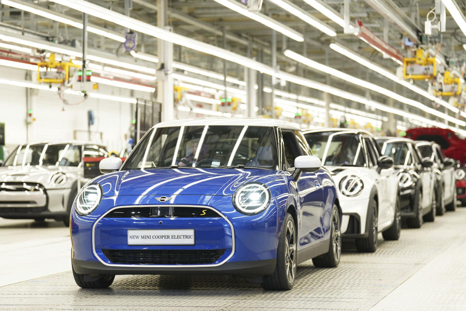 policy incentives MINI cars stand in a row at the MINI plant at Cowley in Oxford, England, Monday, Sept. 11, 2023. German automaker BMW is set to announce plans to build the next generation electric Mini in Britain after securing U.K. government support for a multimillion-pound investment in the company’s Oxford factory. The government on Monday confirmed its backing for the project, which will protect 4,000 jobs. (Joe Giddens/PA via AP)