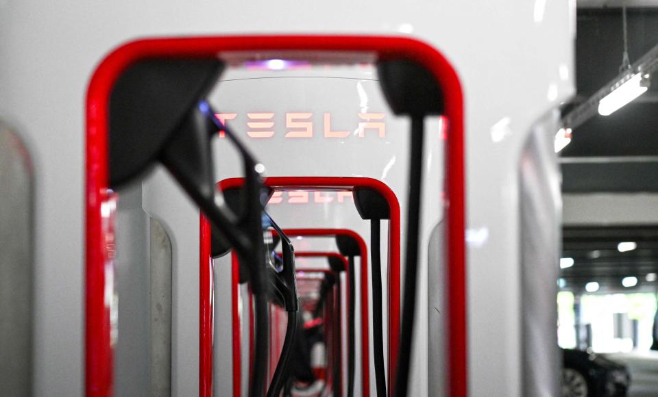 A charging station for Tesla electric cars is pictured at a car park in Berlin, Germany on August 3, 2023. Tesla had reported a jump in second-quarter profits on July 19 as a series of price cuts translated into sharply higher car sales. Elon Musk's electric vehicle company reported profits of USD 2.7 billion, up 20 percent on the year-ago level.