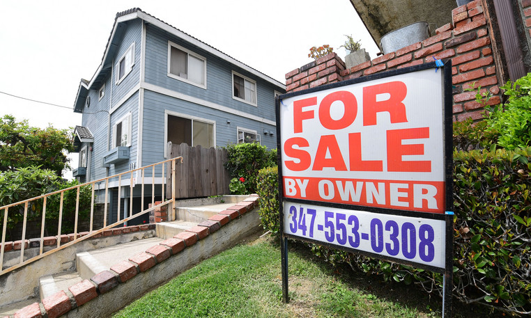 A &quot;For Sale by Owner&quot; sign is posted in front of property in Monterey Park, Calif. on April 29, 2020. 