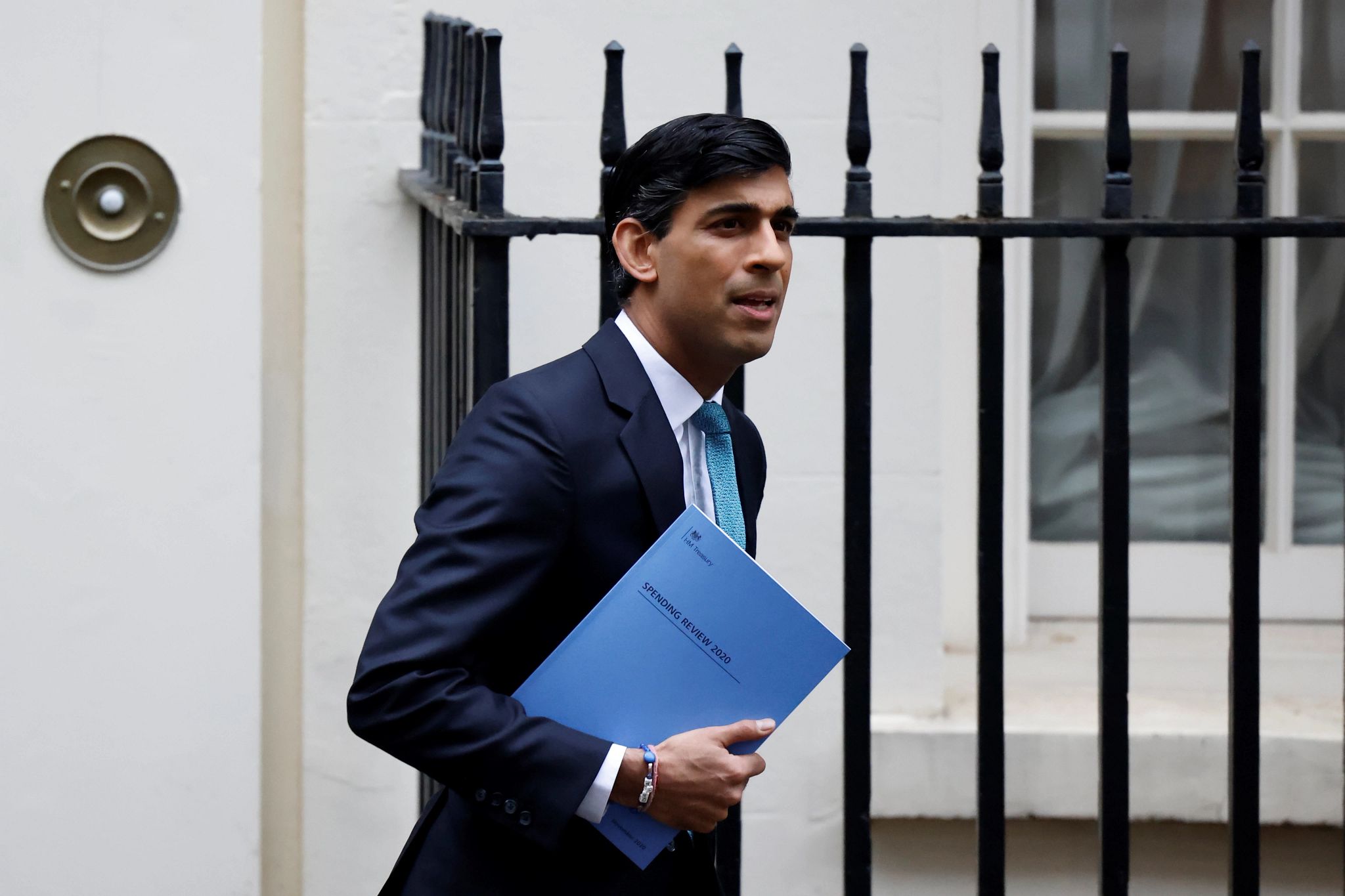 Britain's Chancellor of the Exchequer Rishi Sunak leaves 11 Downing Street in central London, on November 25, 2020, before heading to the House of Commons to present his economic spending review. - Britain's government, seeking to support the pandemic-ravaged economy and the nation's post-Brexit future, will on Wednesday unveil its eagerly-awaited spending plans. Finance minister Rishi Sunak will deliver his spending review to parliament, one week before England ends a month of restrictions aimed at cutting a second wave of infections. (Photo by Tolga Akmen / AFP) (Photo by TOLGA AKMEN/AFP via Getty Images), ; Portrait of a U.K government official person. (Getty Images)