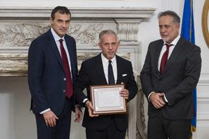 Fabrizio Di Michele, right, President of LaPresse Agency, Marco Durante, middle, and President of Business Care Massimo Veccia, right, attend the 6th Edition of the "Business Care International Award" at the Consulate General of Italy on Thursday, Oct. 26, 2023 in New York.
