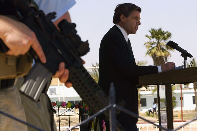 L. Paul Bremer, the top U.S. administrator in Iraq, addresses new members of the Iraqi Police Service in April 2004 in Baghdad. Griffin was part of his security detail.