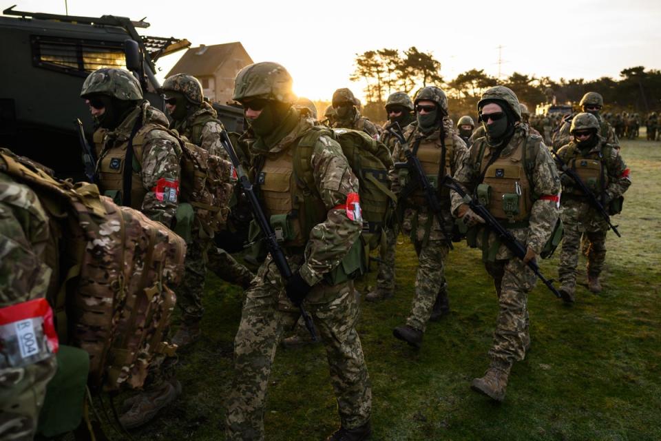 Ukrainian volunteer recruits leave the parade ground after taking part in prayers, blessings and a one minute silence to mark the first anniversary of the 2022 Russian Invasion of Ukraine, on February 24, 2023, during training in South East England. (Getty Images)
