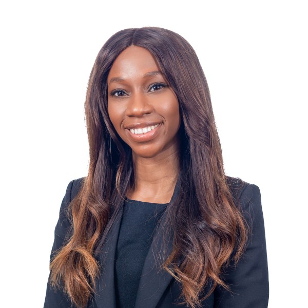 Elizabeth Buko wearing a suit and smiling at the camera 