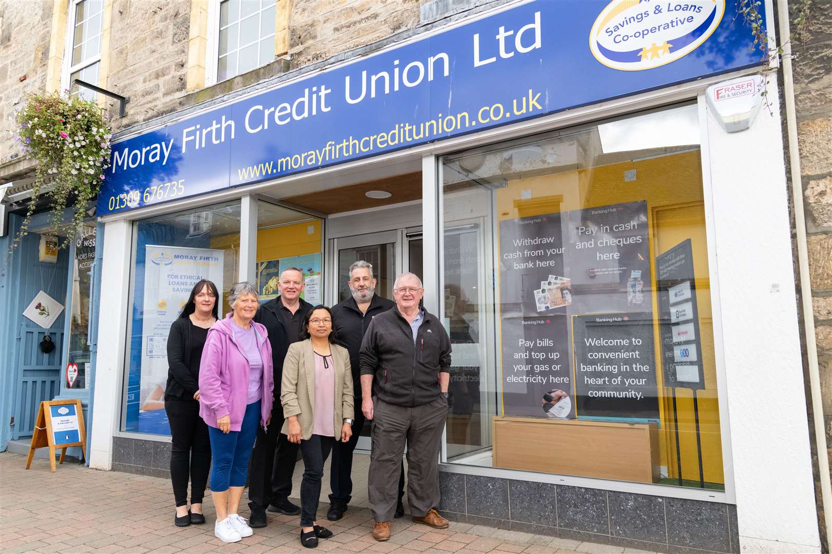 Counter clerk Sylvia McKenzie, Lorna Creswell, Paul McBain, trainee Lodia Cruz, Paul Grant (Bank of Scotland) and teller Jim Lawther.