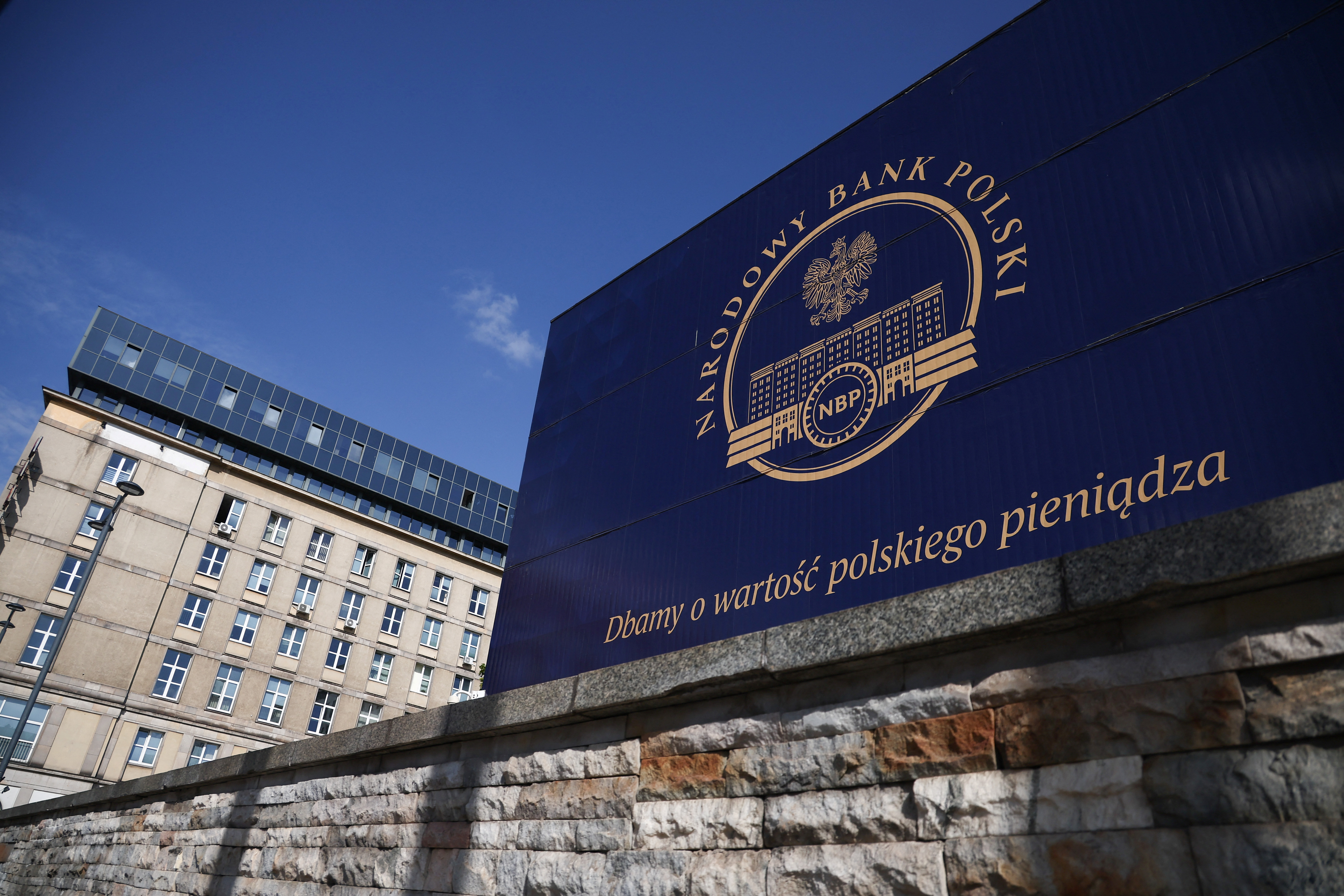 The logo of the Polish Central Bank (NBP) is seen on their building in Warsaw