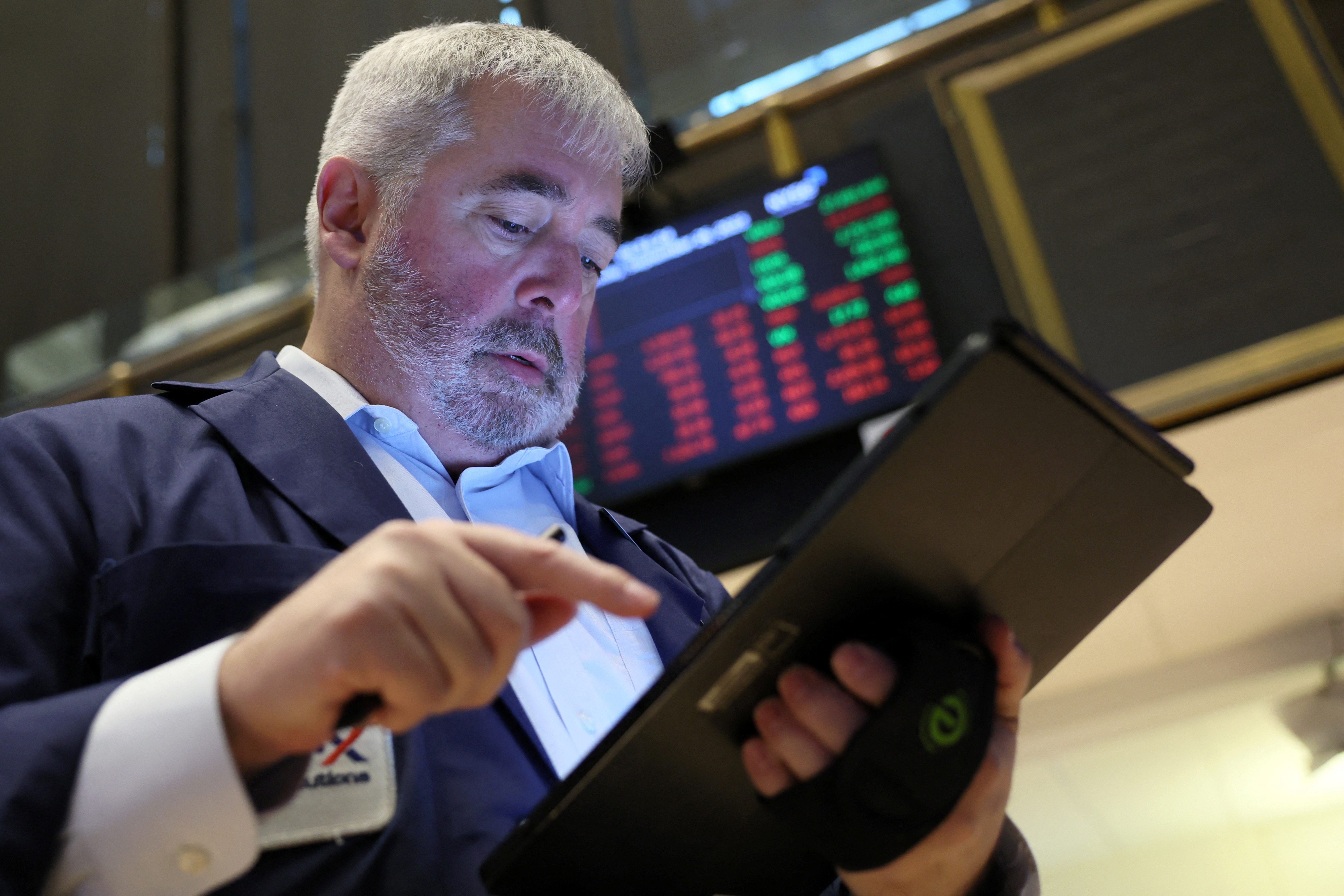 Traders work on the floor of the NYSE in New York