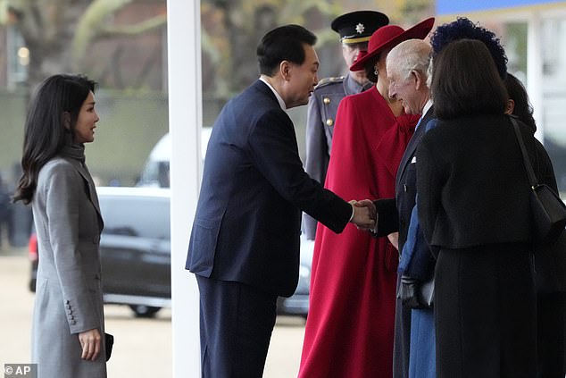 Mr Yoon shook hands with King Charles as he and his wife received a very royal welcome in London today