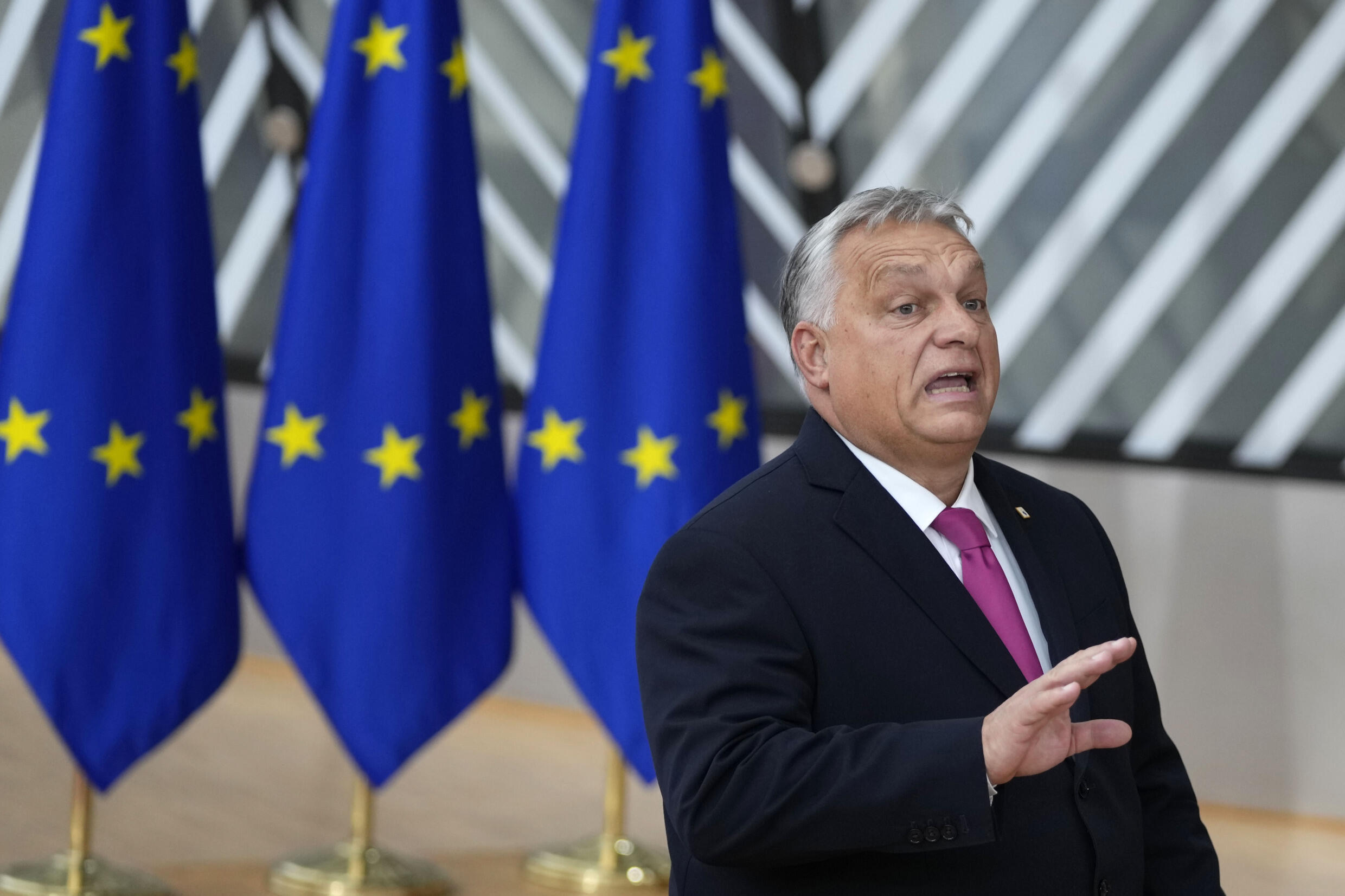 Hungary's Prime Minister Viktor Orban speaks with the media as he arrives for an EU summit at the European Council building in Brussels, Thursday, Oct. 26, 2023. 