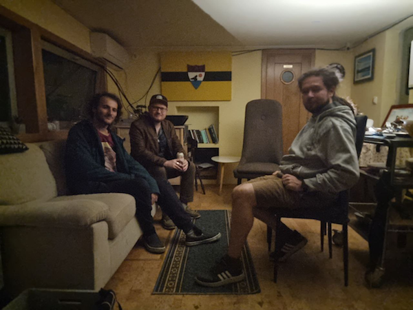 Elias Ahonen (center) with Patrick and Jonas on Liberty, the houseboat where they were living.