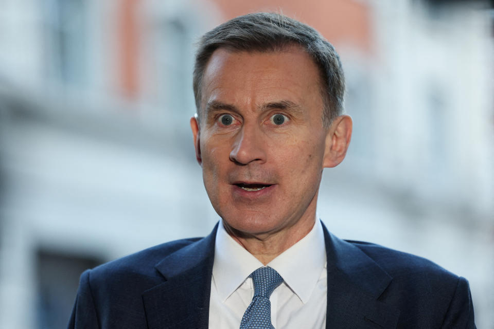 Recession  FILE PHOTO: British Chancellor of the Exchequer Jeremy Hunt speaks to the media outside the BBC Broadcasting House, after his appearance on 'Sunday with Laura Kuenssberg', in London, Britain, November 19, 2023. REUTERS/Isabel Infantes/File Photo