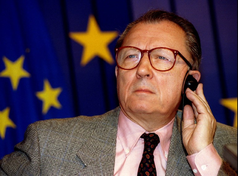 European Union President Jacques Delors listens to a question during a press conference on the book 