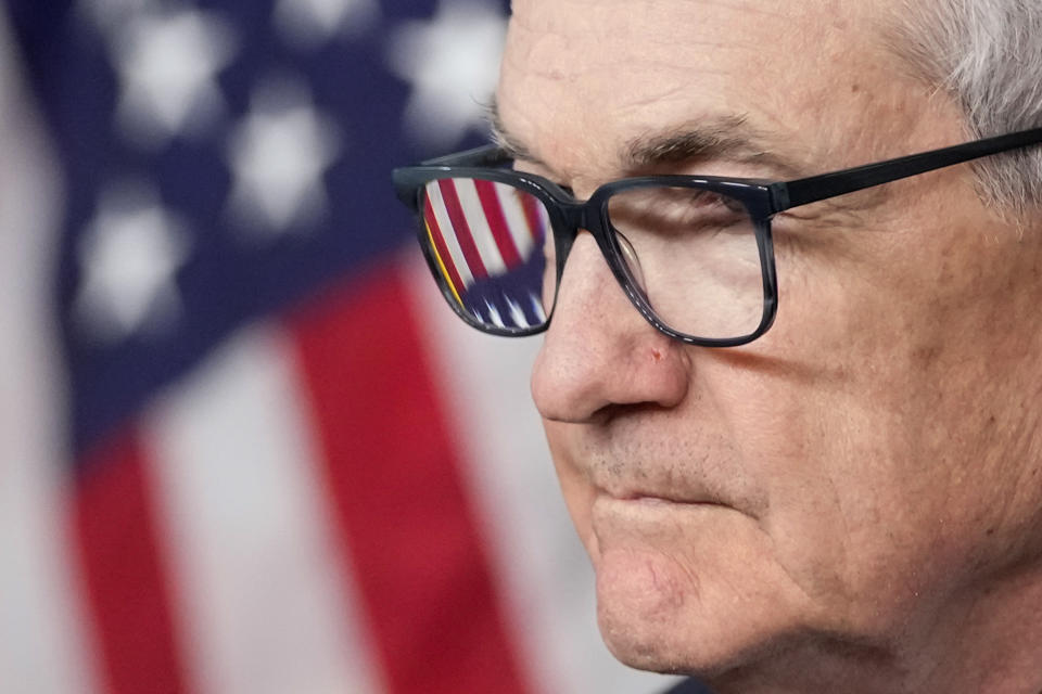 An American flag is seen in Federal Reserve Board Chair Jerome Powell's glasses as he speaks during a news conference about the Federal Reserve's monetary policy at the Federal Reserve, Wednesday, Dec. 13, 2023, in Washington. (AP Photo/Alex Brandon)