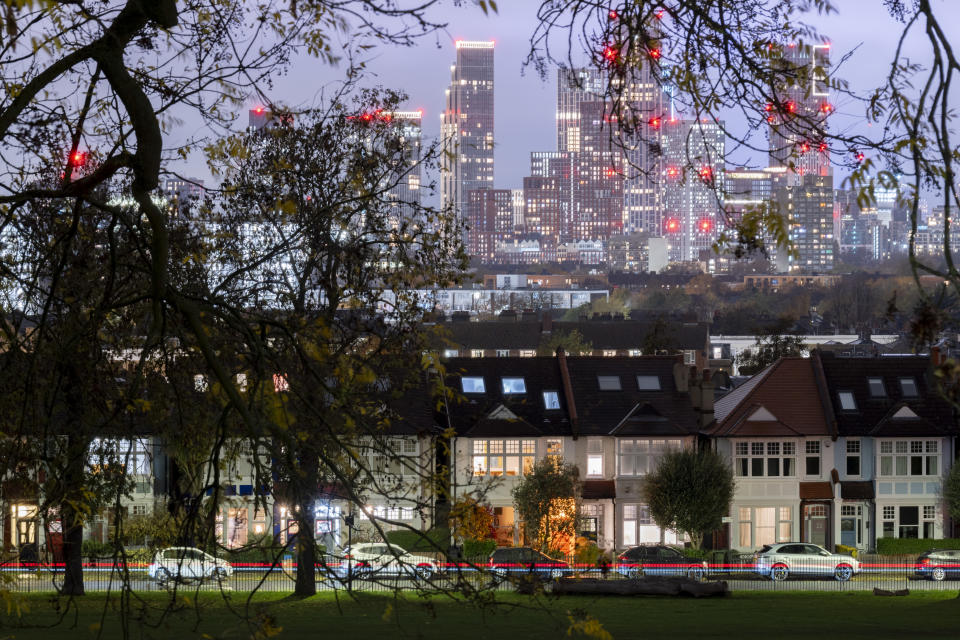 Lit porches of terraced period homes and in the distance, the growing development at Nine Elms at Battersea, seen through the branches of trees in Ruskin Park, a south London green space in Lambeth, on 20th November 2023, in London, England. (Photo by Richard Baker / In Pictures via Getty Images)