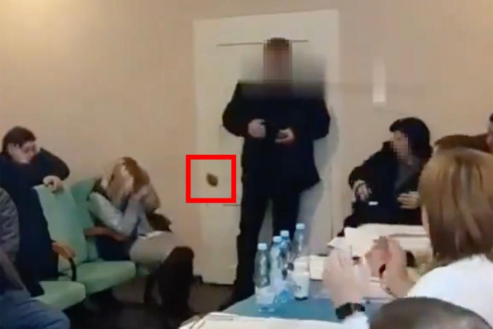 A Ukrainian councillor detonated two grenades at a meeting (grenade circled in red) (Ukraine National Police)