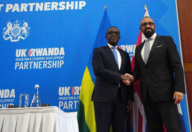 Home Secretary James Cleverly and Rwandan Minister of Foreign Affairs Vincent Biruta shake hands after they signed a new treaty in Kigali, Rwanda