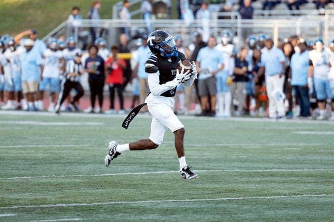 Sep 14, 2023; Wayne, New Jersey, United States; West Orange football at Passaic Tech. PT #1 Cashmere Jones makes a catch on his way to scoring a touchdown in the first quarter. Mandatory Credit: Michael Karas-The Record