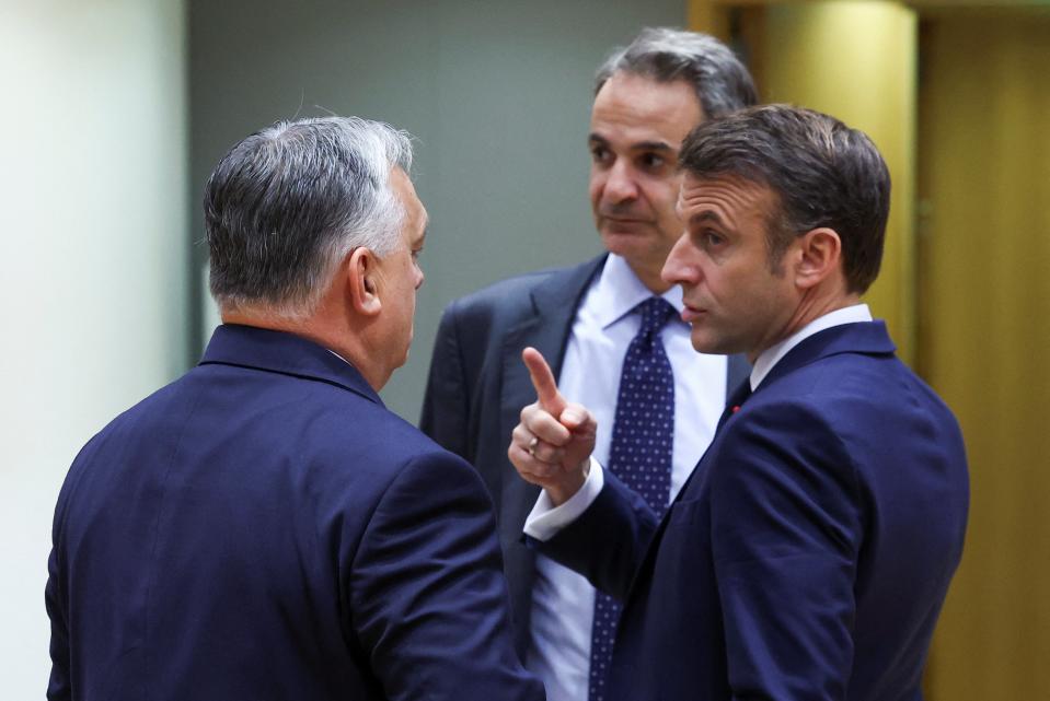 French president Emmanuel Macron talks to Viktor Orban at the sidelines of the EU summit on Thursday (REUTERS)