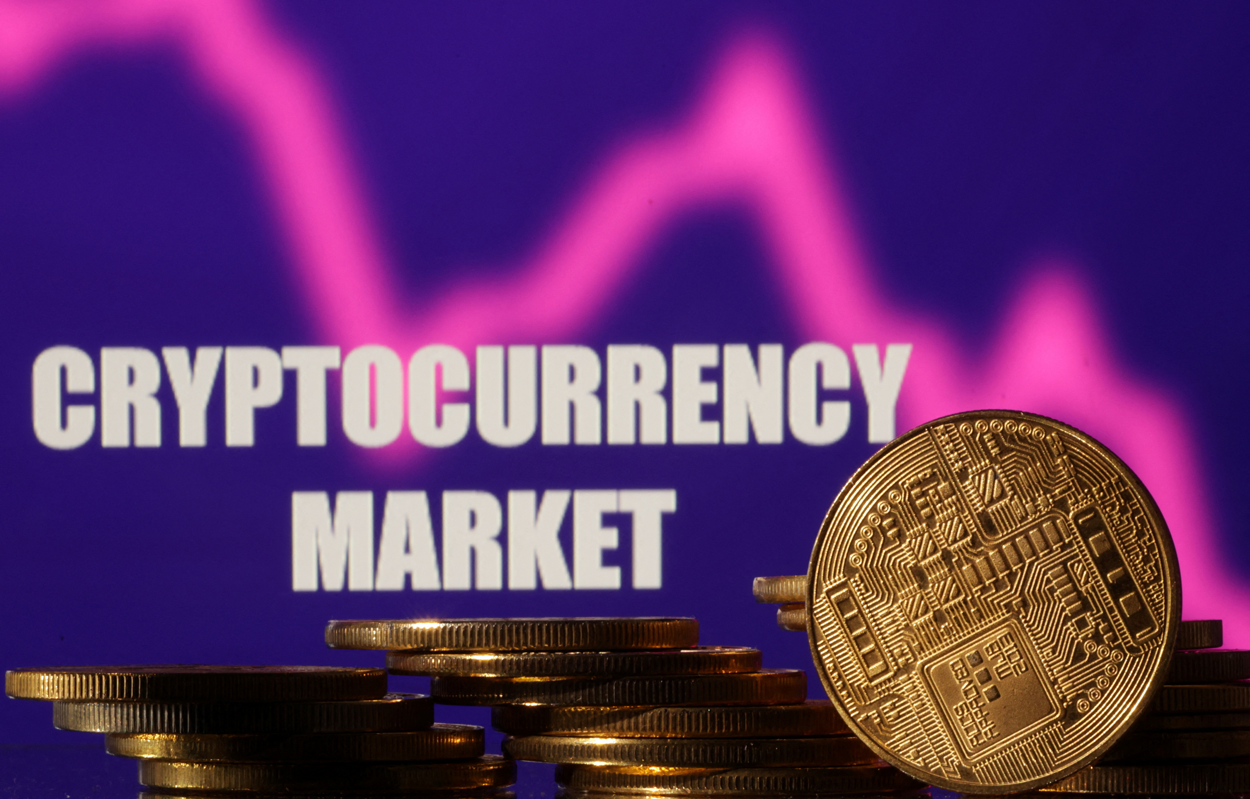 Illustration shows words "Cryptocurrency market", stock graph and representation of cryptocurrencies