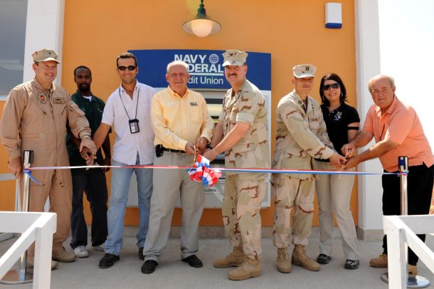 Camp Lemonnier celebrated the opening of the first Navy Federal Credit Union ATM on the African continent at a ribbon cutting ceremony Oct. 31. Pictured left to right, U.S. Navy Rear Adm. Tony Kurta, Combined Joint Task Force-Horn of Africa commander; Shawn Parham, ITT; Muhammed Elam, Petroland Construction; Larry Wood, regional manager for Navy Federal Credit Union; Navy Capt. Bill Finn, commanding officer; Navy Lt. Soon No; Mirra Brown, NEX and George Baker, Public Works cut the ribbon to celebrate the opening of the first Navy Federal ATM on the African continent.