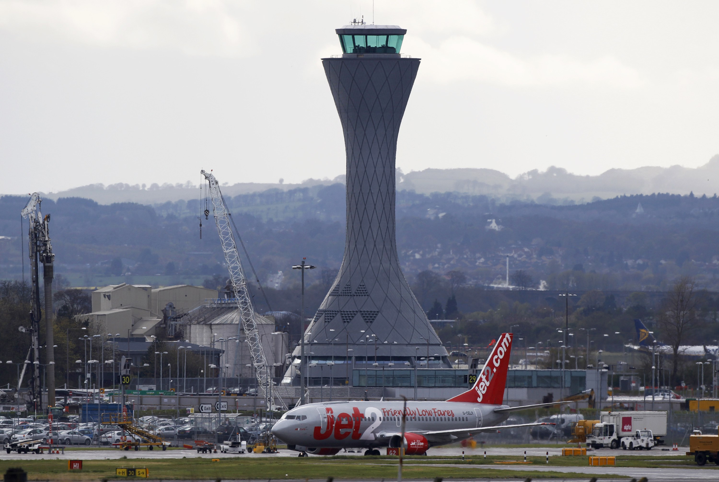 A aircraft taxis past the control tower at Edinburgh Airport in Scotland