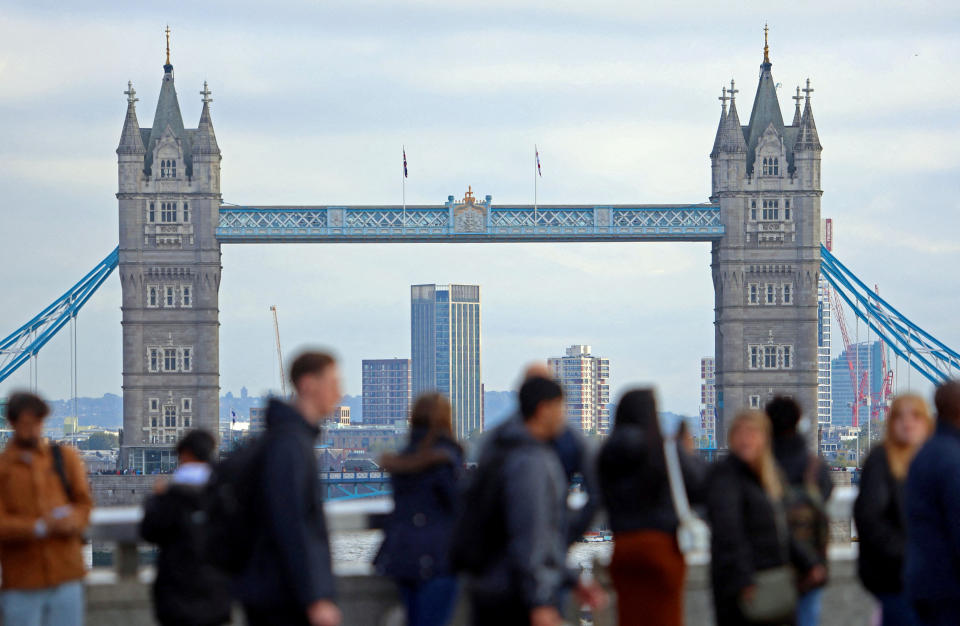 recession FILE PHOTO: People walk over London Bridge looking at a view of Tower Bridge in the City of London financial district in London, Britain, October 25, 2023. REUTERS/ Susannah Ireland/File Photo