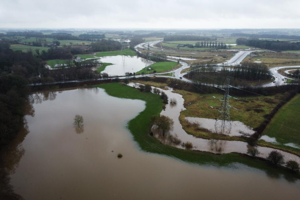 An aerial photograph taken by drone of floodwater from the River Bollin in Little Bollington, Britain (EPA)