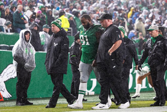 Nov 26, 2023; Philadelphia, Pennsylvania, USA; Philadelphia Eagles defensive tackle Fletcher Cox (91) is helped off the field after being injured during the second quarter against the Buffalo Bills at Lincoln Financial Field. Mandatory Credit: Bill Streicher-USA TODAY Sports