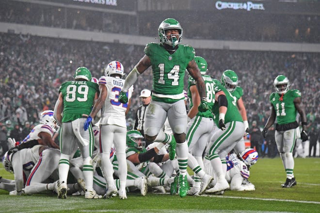 Nov 26, 2023; Philadelphia, Pennsylvania, USA; Philadelphia Eagles running back Kenneth Gainwell (14) celebrates touchdown run by quarterback Jalen Hurts (1) (not pictured) against the Buffalo Bills during the first quarter at Lincoln Financial Field. Mandatory Credit: Eric Hartline-USA TODAY Sports