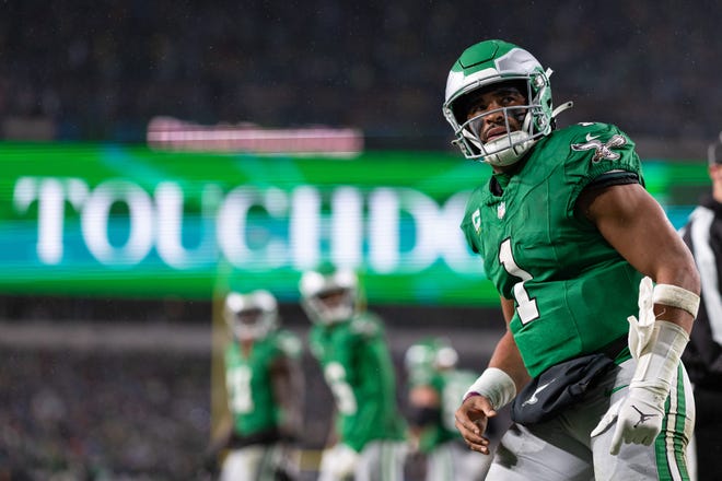 Nov 26, 2023; Philadelphia, Pennsylvania, USA; Philadelphia Eagles quarterback Jalen Hurts (1) looks into the stands after scoring a touchdown against the Buffalo Bills during the first quarter at Lincoln Financial Field. Mandatory Credit: Bill Streicher-USA TODAY Sports